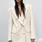 Manteau court double face à taille marquée